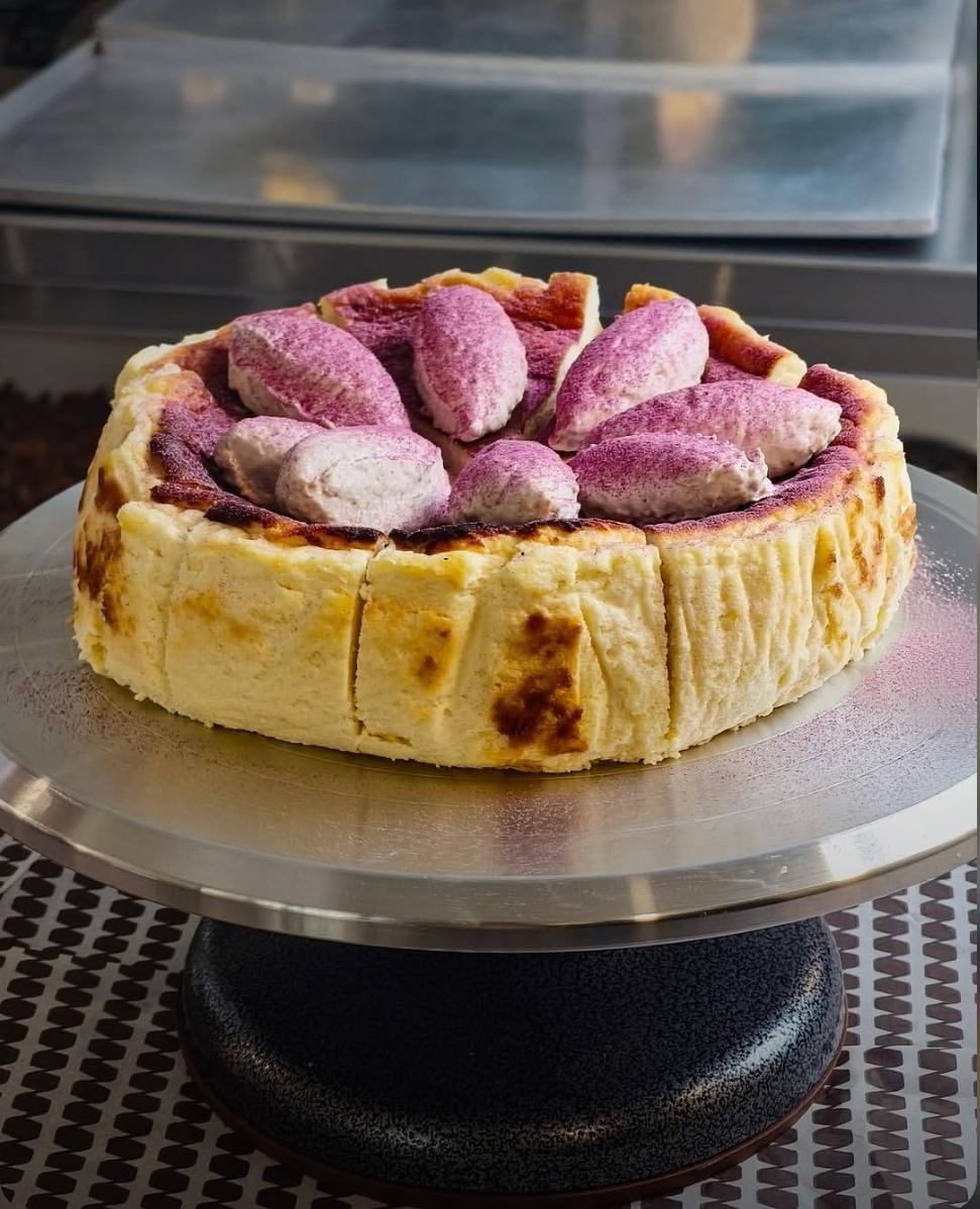 Basque Cheesecake topped with lavender cream and berry powder